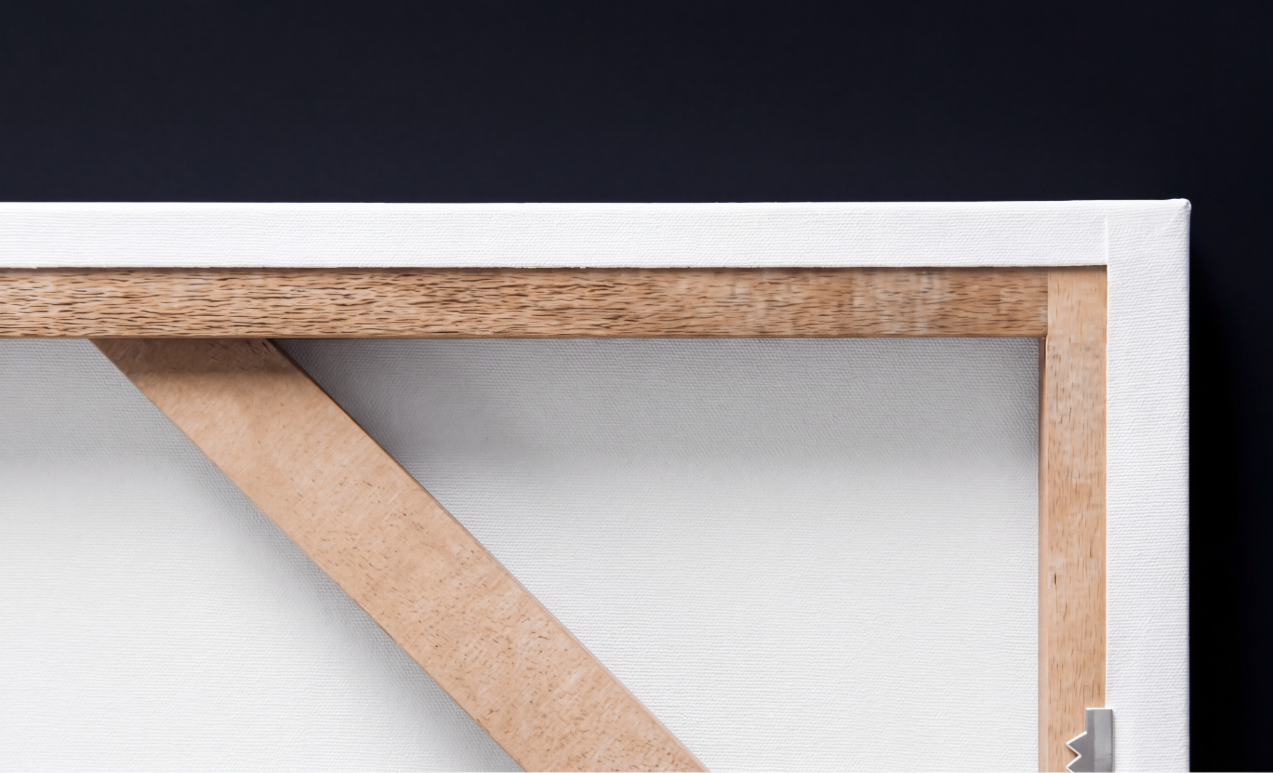 Detail of hand-stretched archival canvas on solid wood frame