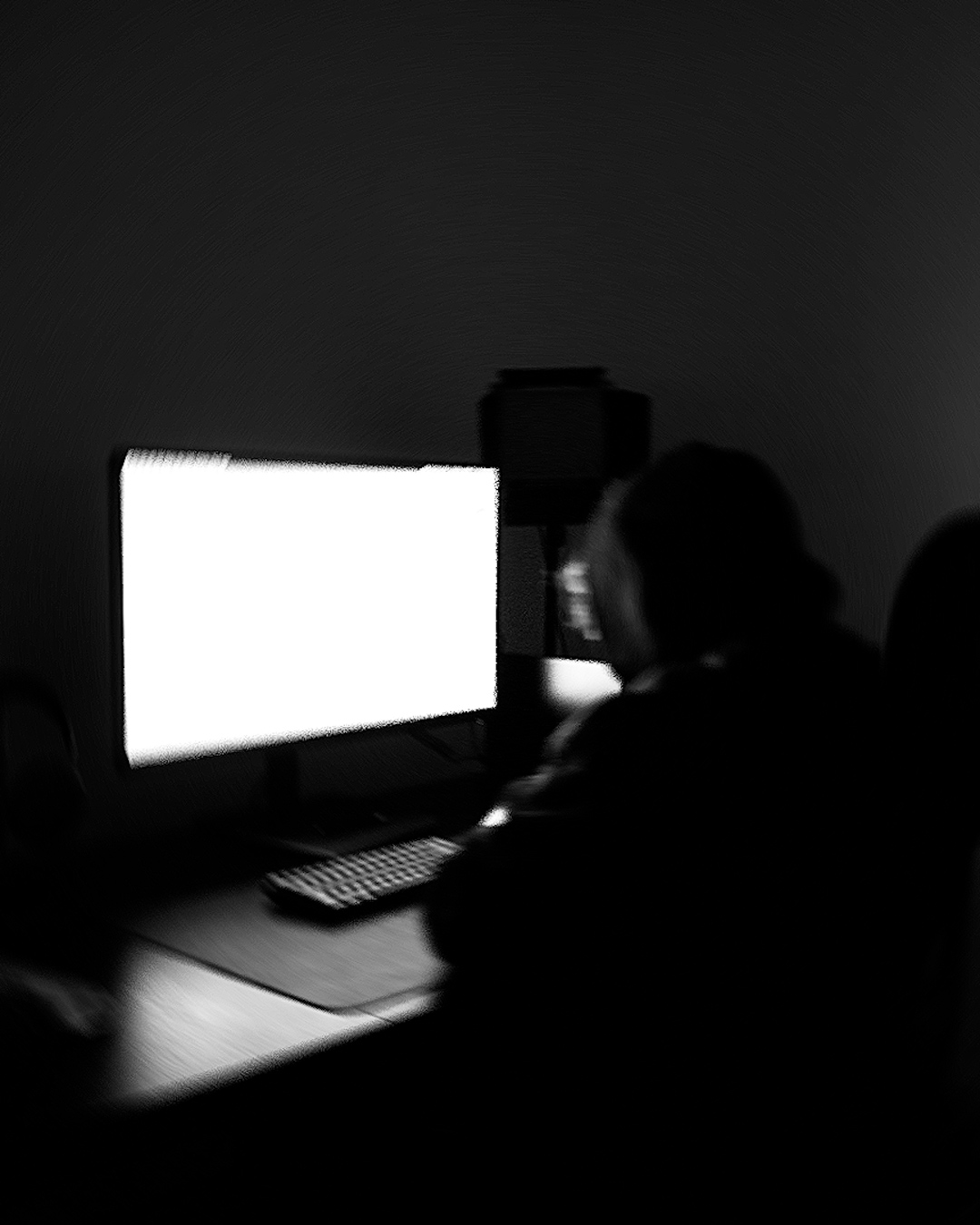 George Cox working at his desk